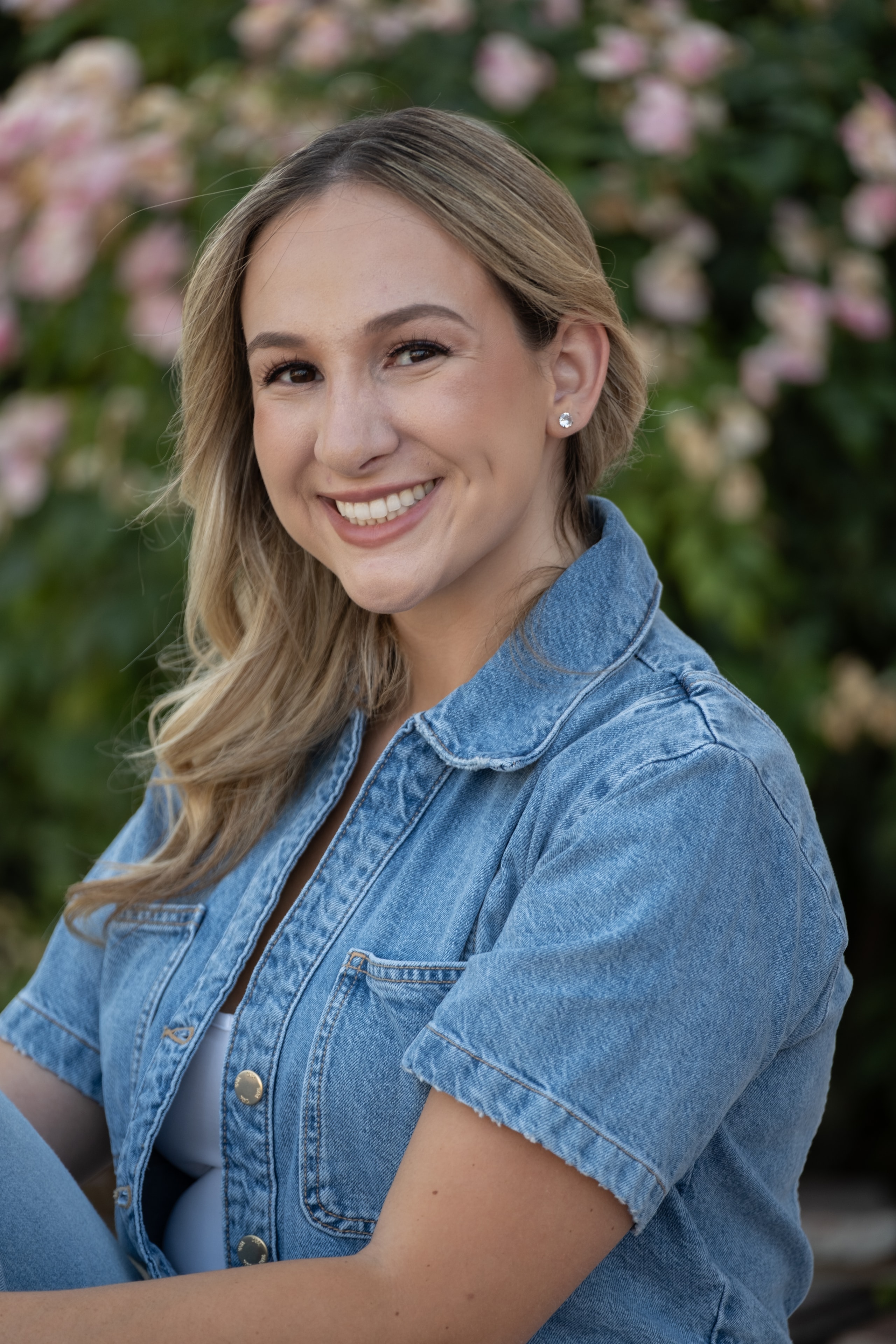 Katie Castillo headshot — dramatic studio portrait